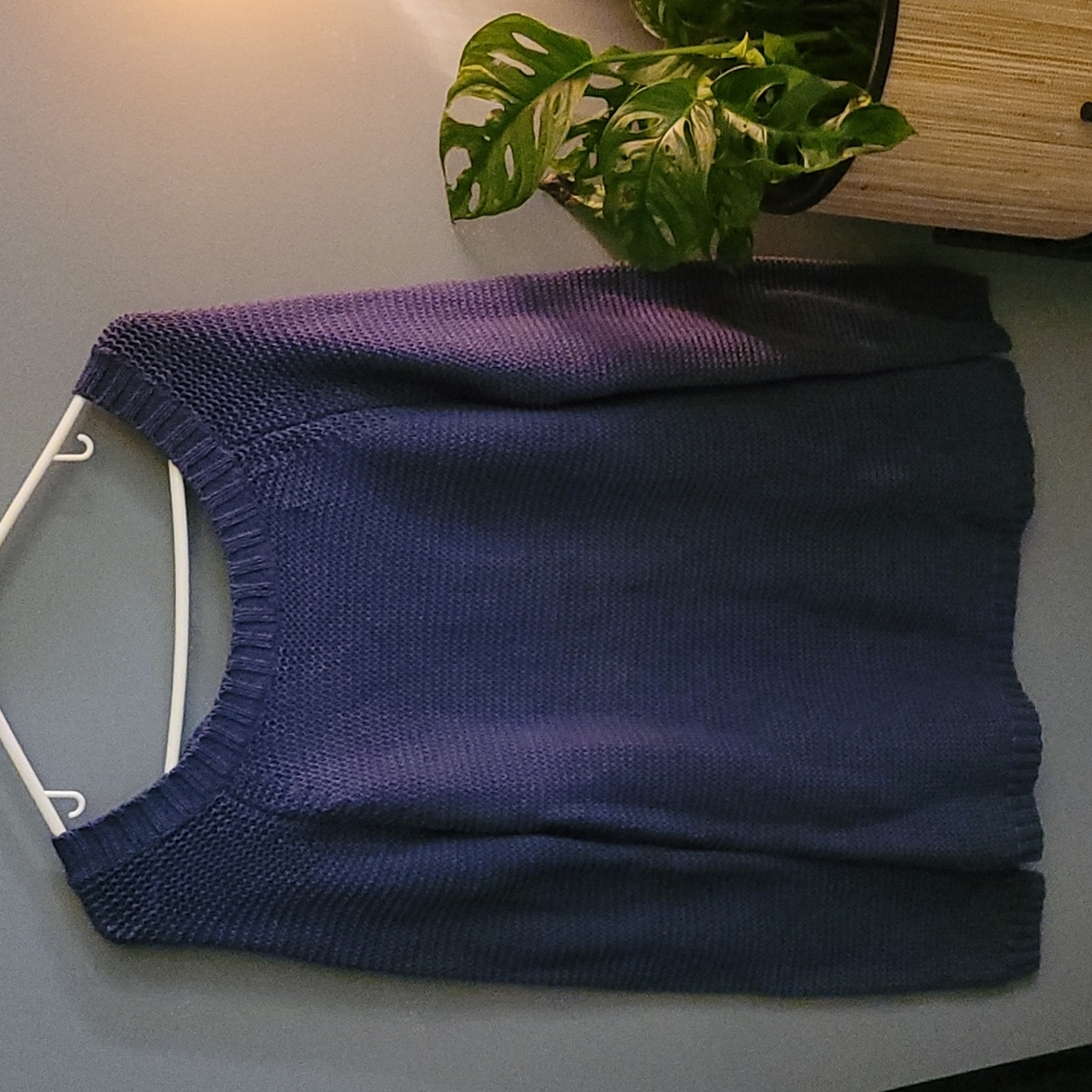 Blue sweater dress with tie back.